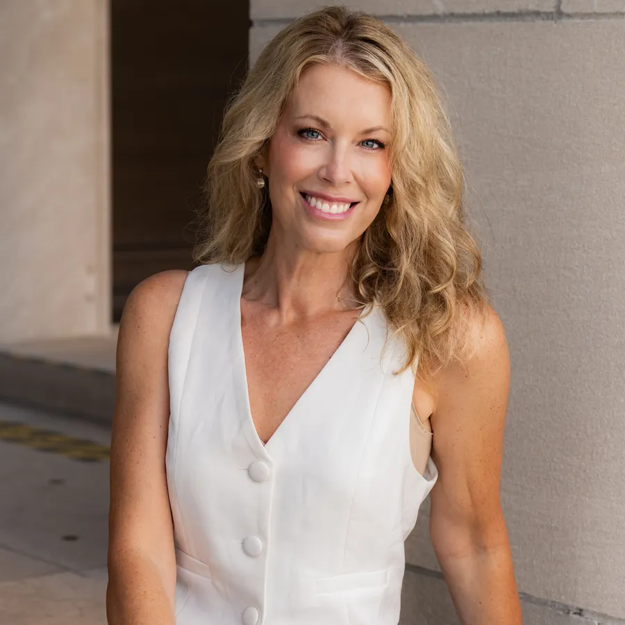 Cara Painter, Compass Realtor in Kansas City, smiling outdoors